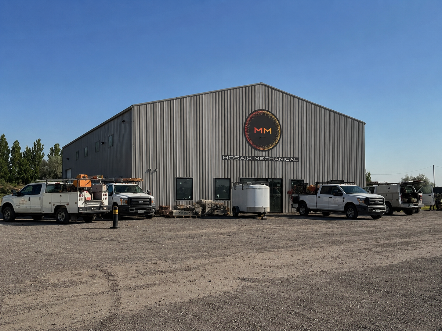 Mosaix Mechanical headquarters building in Burley Idaho with service trucks