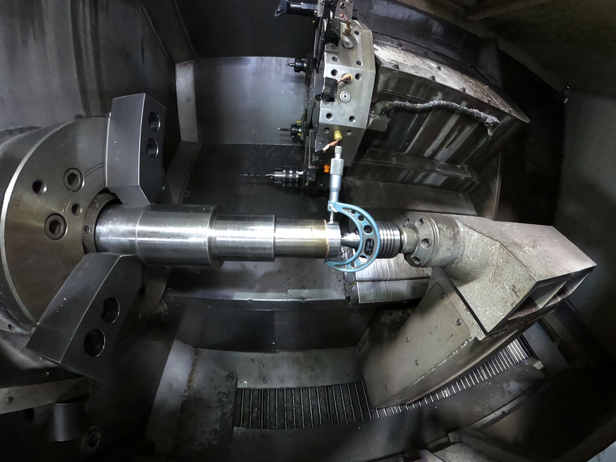 Measuring a machined shaft diameter with a micrometer at Mosaix Mechanical