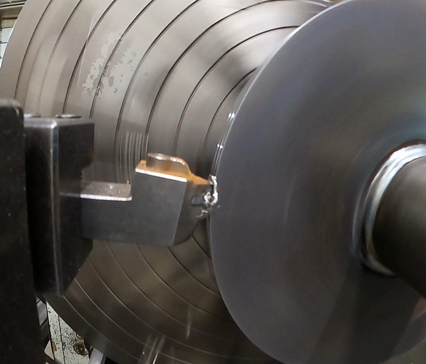 Carbide insert cutting a large-diameter component in a lathe at Mosaix Mechanical
