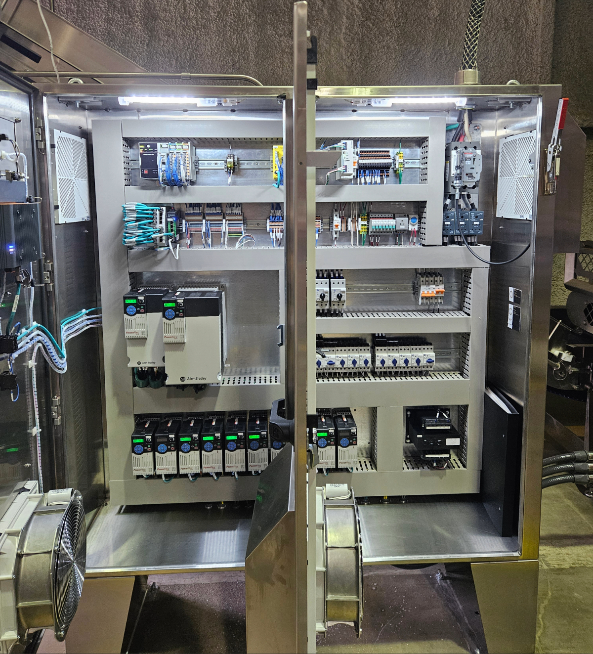 Stainless steel washdown control panel with Allen-Bradley PowerFlex VFD built by Mosaix Mechanical for a food processing plant