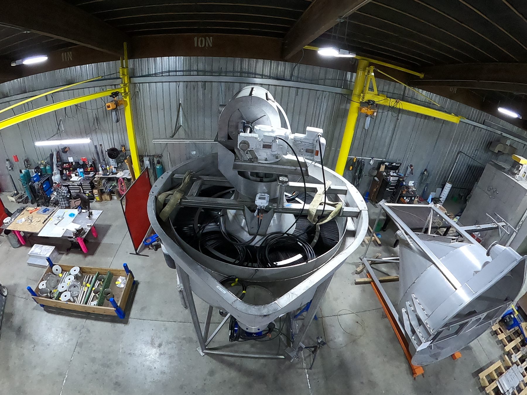 Stainless steel conical hoppers under fabrication at Mosaix Mechanical in Burley, Idaho