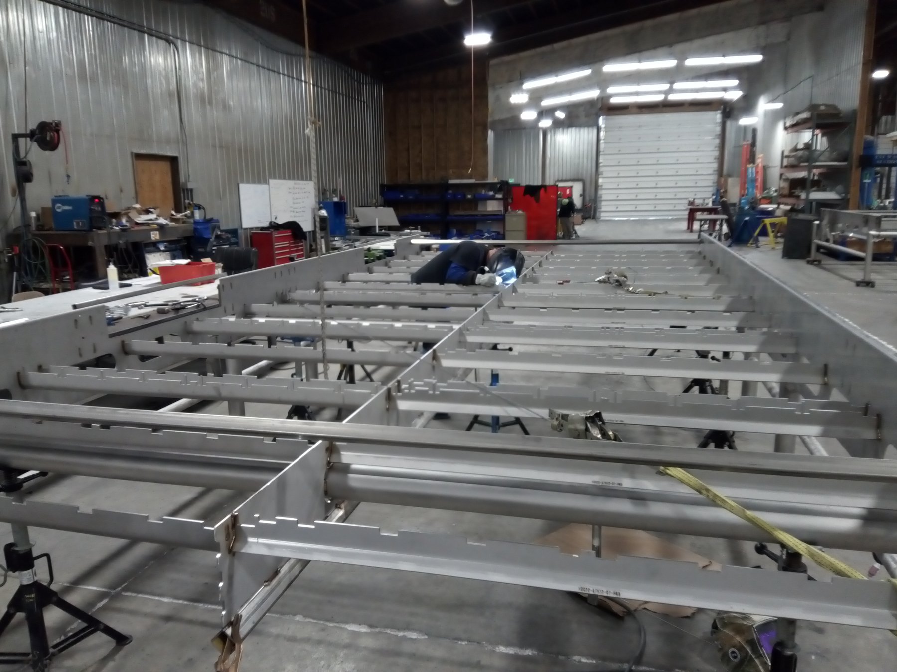Large stainless steel equipment frame and deck structure under construction in the Mosaix Mechanical fabrication shop